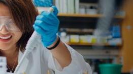 Female student conducting chemistry experiment