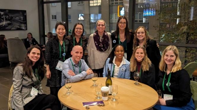 Carolyn Becker poses for a photo with some colleagues and former 学生