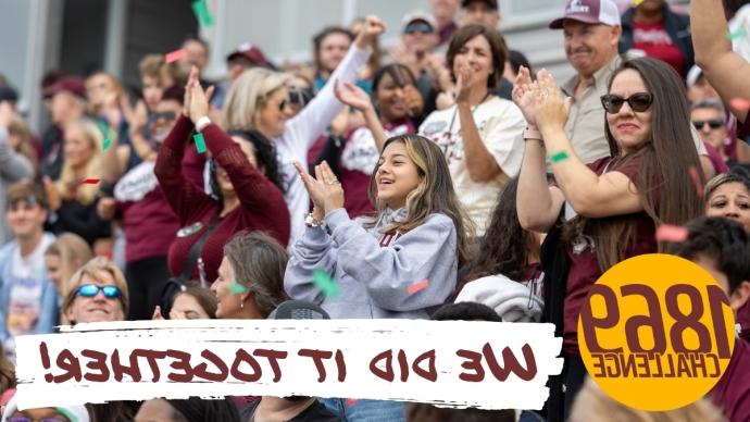 Crowd applauding at football game