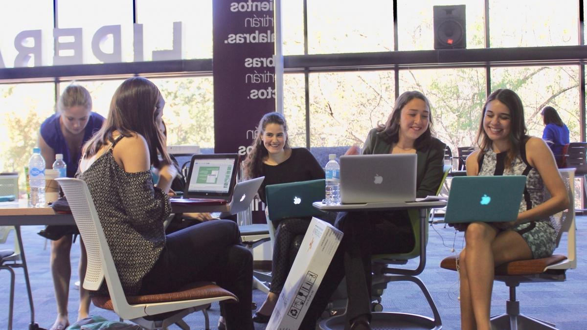 Students sitting in chairs talking